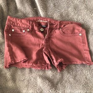Maroon jean shorts by American Eagle
